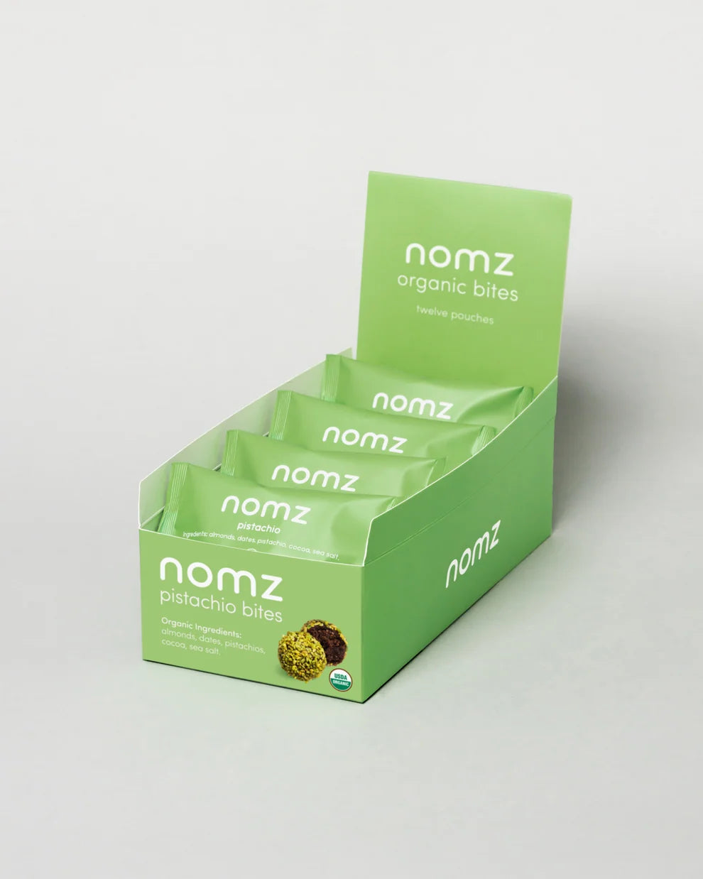 NOMZ Organic Pistachio Bites in green package